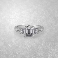 3 stone engagement ring laying down position in white gold 3D render photo