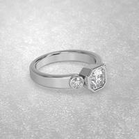 three stone engagement ring laying down position in metal gold 3D render photo
