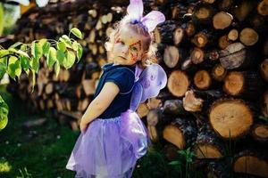 beautiful girl in a fairy costume with butterfly wings photo
