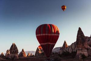 Amazing sunset over Cappadocia. Beautiful color balloons. Turkey photo