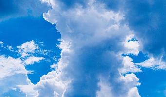 white fluffy clouds sky background with blue sky background for copy space. photo