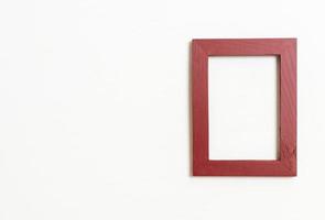 empty picture frame on white wall background photo