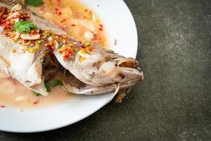 Steamed grouper fish with lime and chillies photo