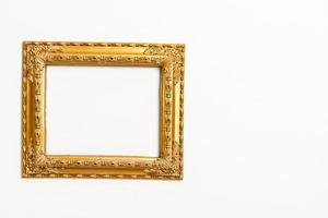 empty picture frame on white wall background photo