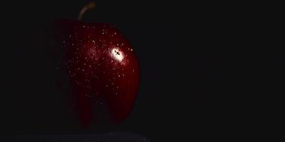 red apple in dew drops and glare on it video