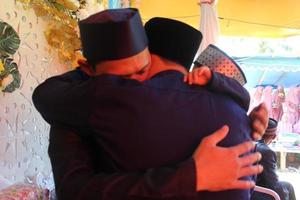 June 2, 2021 in Cianjur Regency, West Java, Indonesia, a groom hugs his brother.  A photo that fits the theme of a touching meeting.