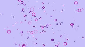 fondo de movimiento de partículas de círculo azul y rosa. animación de papel tapiz descolorida con color pastel. burbuja voladora. video