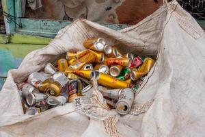 Trancoso, Bahia, Brazil, March 9 2022 Beer cans piled up in a large sack to be taken to be recycled