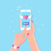 Valentine's day illustration. Send or receive love sms, letter, email with mobile phone. White cellphone in hand isolated on background. Flying red heart with wings. Vector flat design