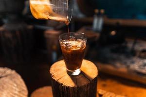 iced coffee in a glass making iced americano photo