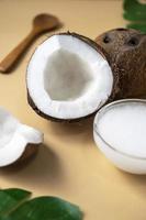 Coconut oil with fresh nut. Healthy alternative oil for cooking and skin care. photo