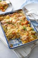 Vegetable gratin with sweet potato, celery, parsnip, carrot, cheese and eggs. Comfort, rustic one casserole food. photo