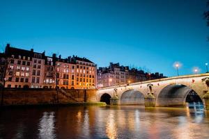 Twilight scene from Paris Seine River with fantastic colors during sunset.