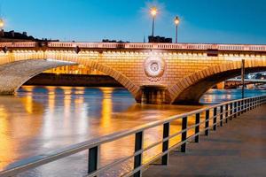 Twilight scene from Paris Seine River with fantastic colors during sunset. photo