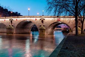 Twilight scene from Paris Seine River with fantastic colors during sunset. photo
