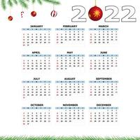 Calendar 2022 template on a white background. Week starts on Sunday, holidays in red colors. Vector illustration.