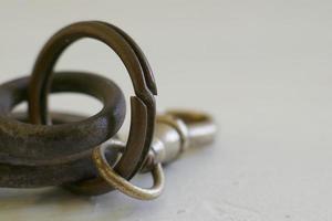 Old Iron Keys and Keychain against White Background photo