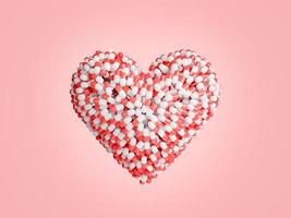 medicine capsules stacked in the shape of a heart photo