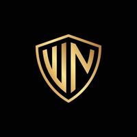 golden initial letter WN shield logo design vector