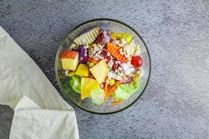 Healthy salad in a bowl on the table photo
