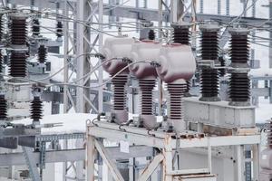 Measuring current transformers at a high-voltage substation. Electric power elements of urban infrastructure. photo