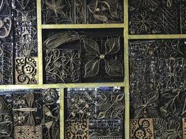 Details, structure and ornaments of forged iron gate. Floral decorative ornament, made from metal. Vintage metallic pattern. Decorative elements as a background. photo