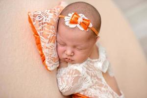 Close-up beautiful sleeping baby girl. Newborn baby girl, asleep photo