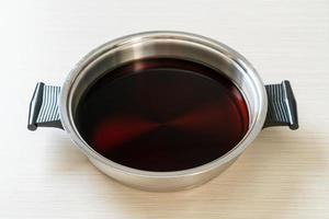 black soup in hot pot for shabu or sukiyaki photo