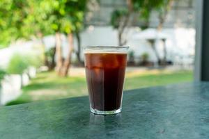 iced americano coffee glass on table photo