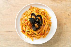 Spaghetti pasta with mussels or clams and tomato sauce photo