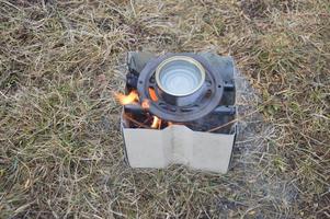 Metal stove for burning wood chips and firewood photo