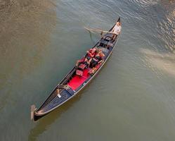 Venice Italy August 2017 Romantic journey in gondola in the lagoon veneta photo