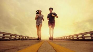 Two runners ran outside. And running on jogging roads. The concept of creating good health photo
