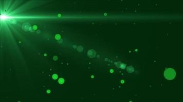 Green glow floating  particles and flare space background photo