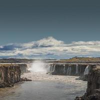 Wonderful waterfall Selfoss in Iceland, summer with copy space gradient background. photo