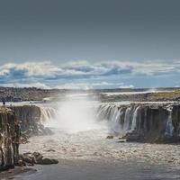 Wonderful waterfall Selfoss in Iceland, summer with copy space gradient background. photo