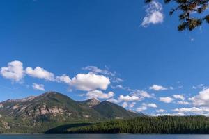 Mountains surrounding Holland Lake in Montana photo