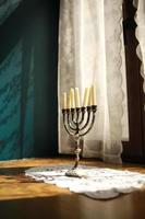 Candles in vintage copper candle holder on wooden table near the window in country house interior photo