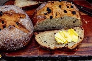 Irish soda bread sliced spread with butter photo