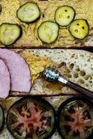 detail of ham sandwich preparation photo