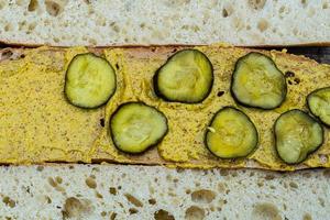 cuban sandwich preparation mustard pickles photo