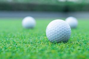 a group of golf ball on green grass photo