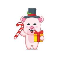 lindo personaje de dibujos animados de oso polar con dulces de navidad y regalo vector