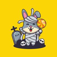 Cute rabbit with mummy costume holding halloween candy vector