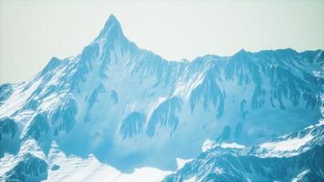 Mountain winter Caucasus landscape with white glaciers and rocky Peak photo