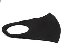 black mask for protection from pandemic outbreak on white background photo