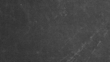 solid dark gray fabric texture background with copy space for image or text. Black canvas abstract photo