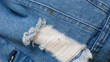 jeans de mezclilla para diseño de moda, fondo de textura de tela de jeans de mezclilla con espacio de copia para imagen o texto. foto