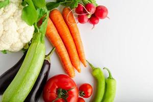 Isolated group of winter season vegetables over white flat lay view. Includes copy space. photo