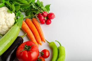 Isolated group of winter season vegetables over white flat lay view. Includes copy space. photo